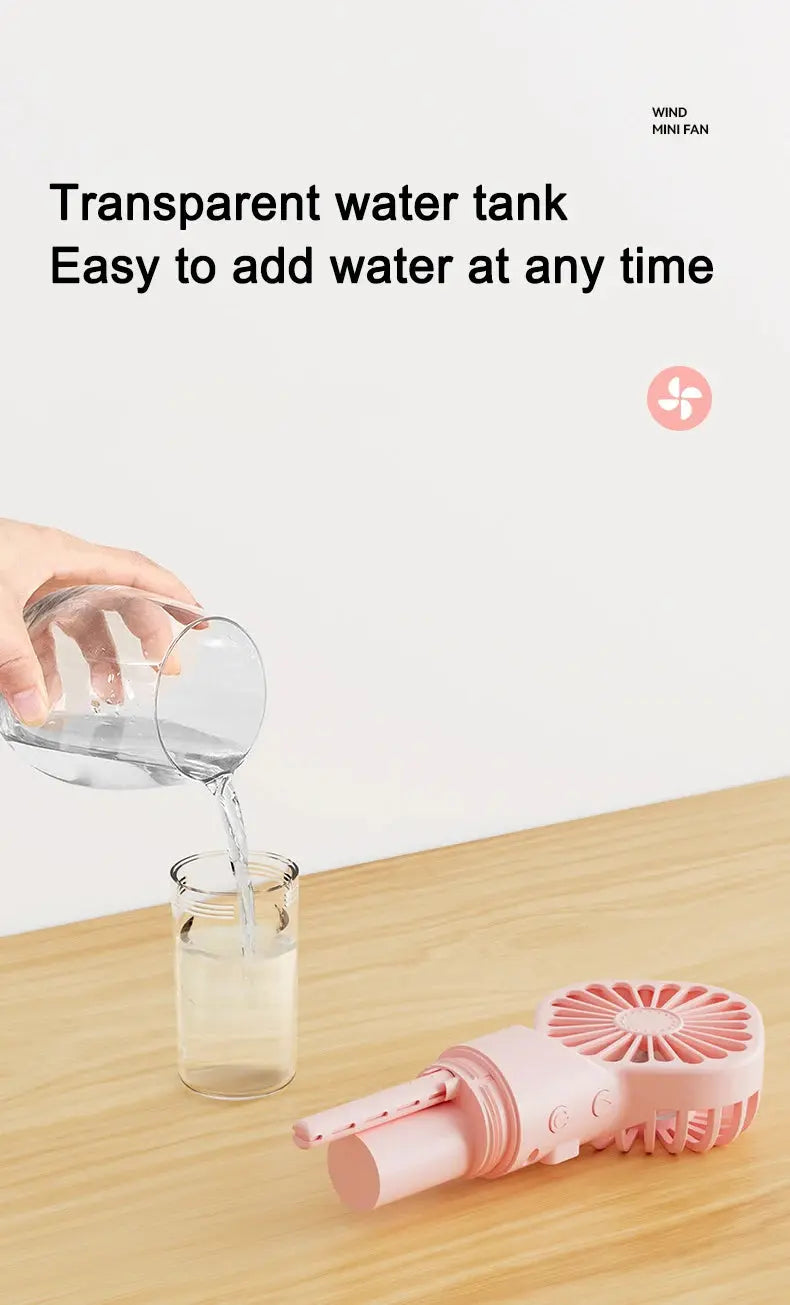 Mini fan with charging cable and spray. True Value