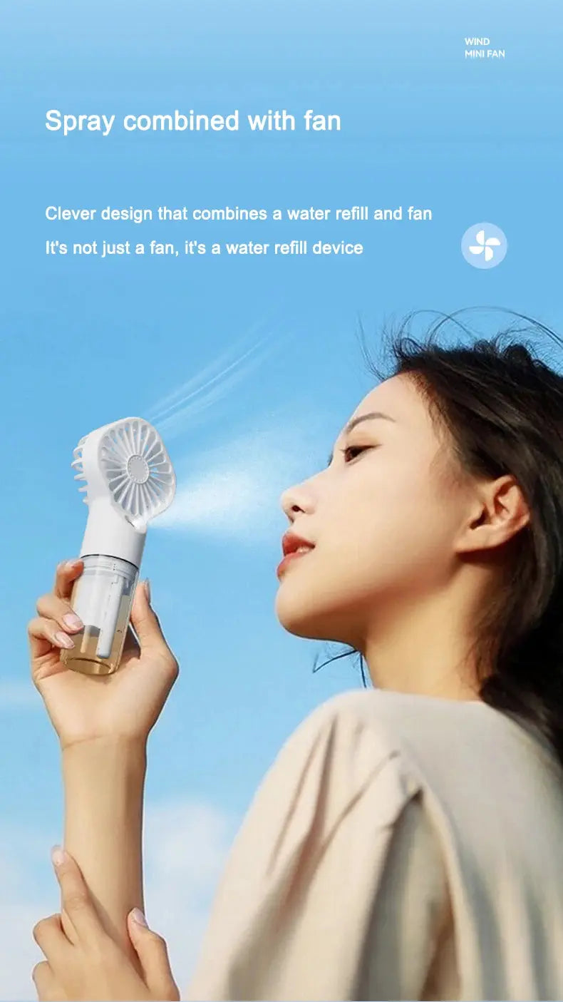 Mini fan with charging cable and spray. True Value