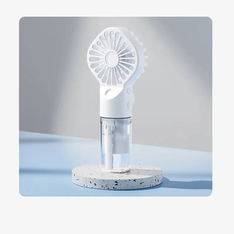 Mini fan with charging cable and spray. True Value
