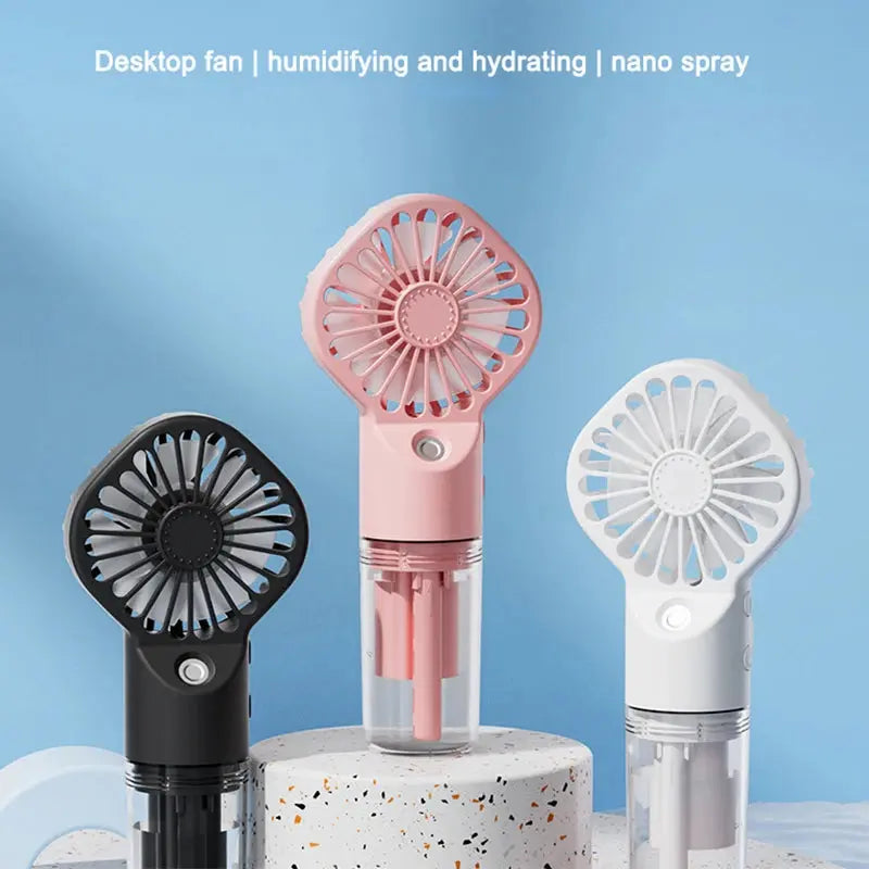 Mini fan with charging cable and spray. True Value