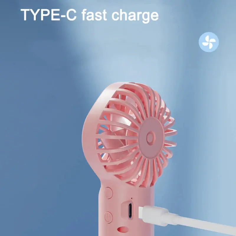 Mini fan with charging cable and spray. True Value