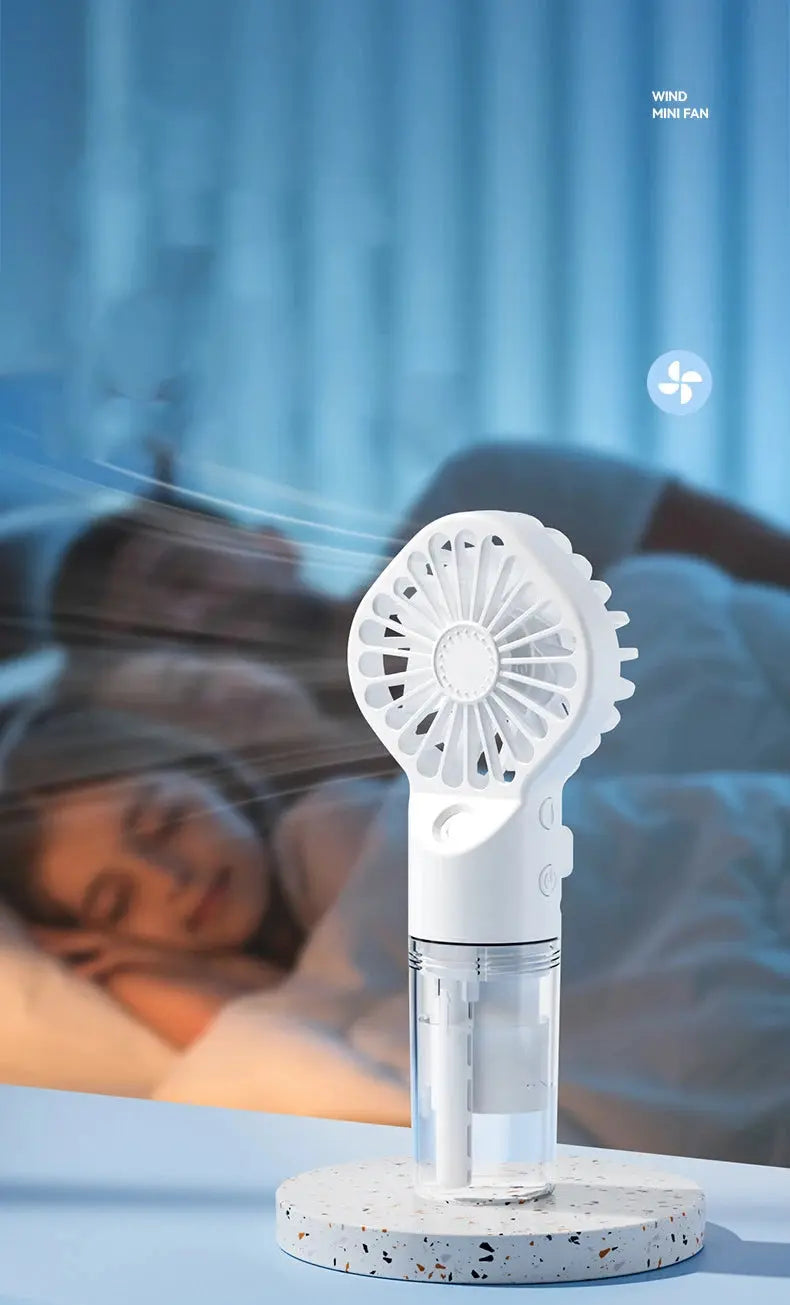 Mini fan with charging cable and spray. True Value