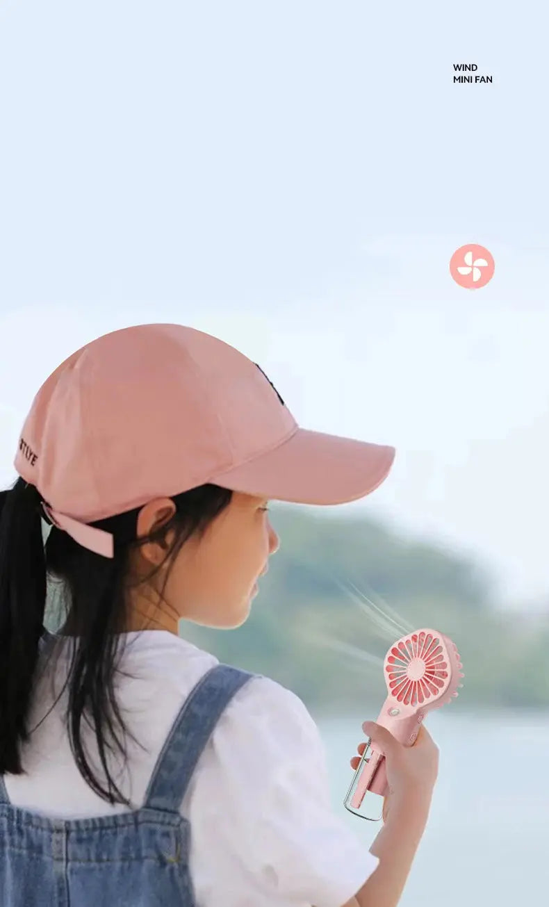 Mini fan with charging cable and spray. True Value