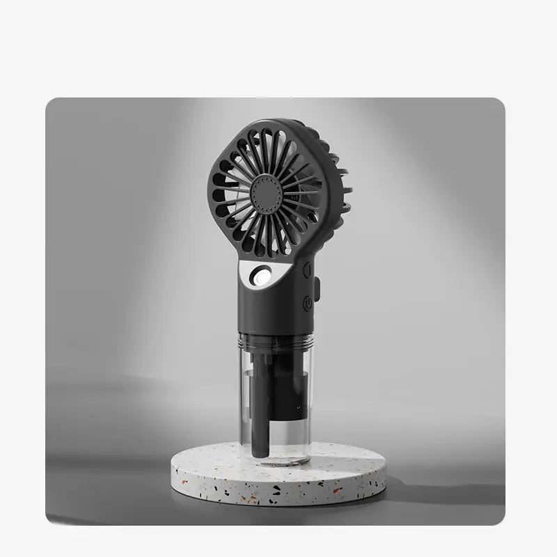 Mini fan with charging cable and spray. True Value